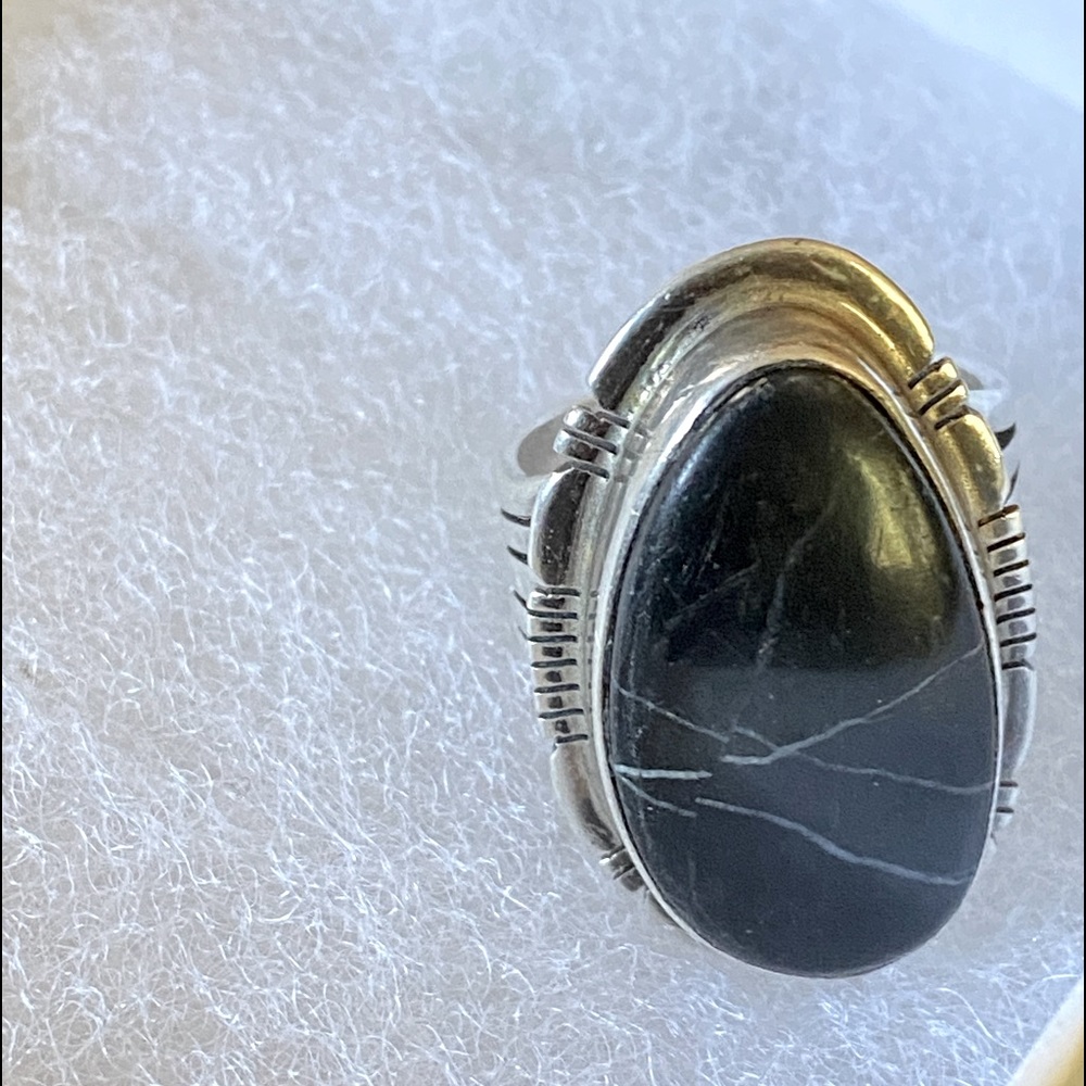 Gently used sterling silver Native American sign ring with white lighting stone